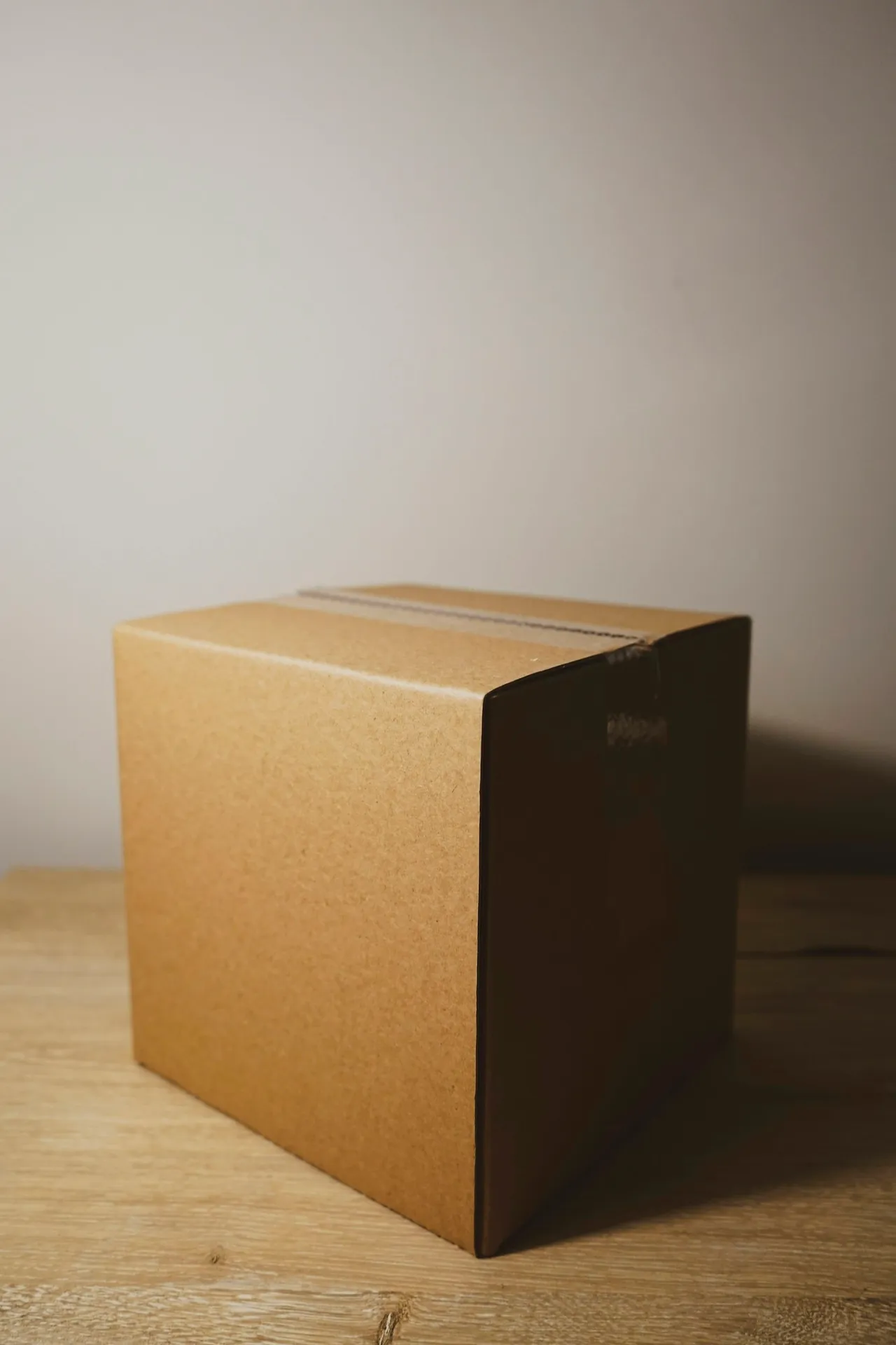 A kraft crate box, packed and taped